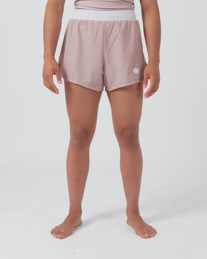 Kingz Hybrid Women's Shorts Terra Soil - Full Body Front View Female Athlete Dusty Rose Mauve Color White Elastic Waistband White Crown Logo Left Thigh Competition Cut Women's Grappling Shorts No-Gi BJJ [color:Baby Pink]