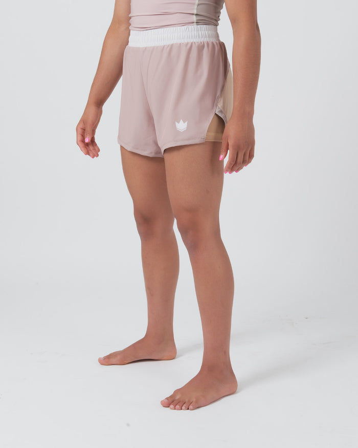 Kingz Hybrid Women's Shorts Terra Soil - Full Body Right Side Profile Female Athlete Dusty Rose Mauve Color White Crown Logo Left Thigh White Elastic Waistband Inner Lining Visible Competition Cut Women's Grappling Shorts No-Gi BJJ [color:Baby Pink]