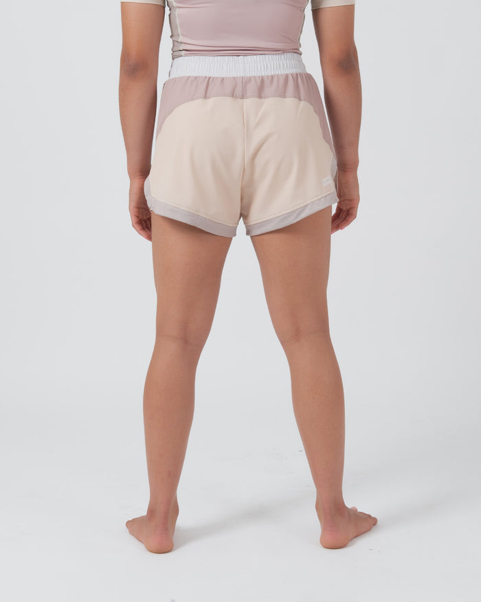Kingz Hybrid Women's Shorts Terra Soil - Full Body Back View Female Athlete Two-Tone Color Block Cream Sand Back Panel Dusty Rose Waistband Gray Trim Accent Side Splits Visible Women's Grappling Shorts No-Gi BJJ [color:Baby Pink]