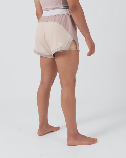 Kingz Hybrid Women's Shorts Terra Soil - Full Body Left Side Profile Female Athlete Two-Tone Cream Sand Back Dusty Rose Front Panel KINGZ Badge Right Side Gray Trim Inner Lining Visible Competition Cut Women's Grappling Shorts No-Gi BJJ [color:Baby Pink]