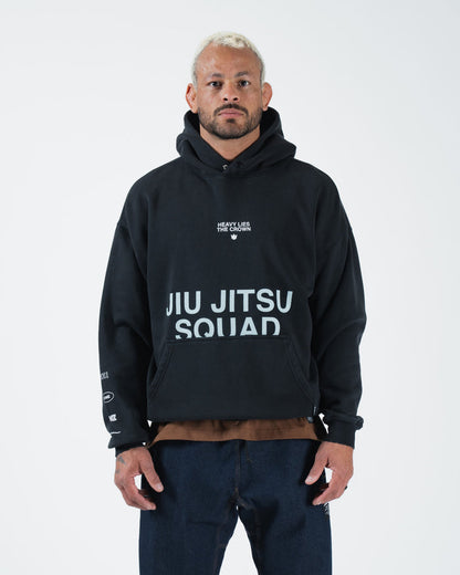 Black BJJ pullover hoodie front view on adult male model showing Jiu Jitsu Squad chest print and pocket [color:Black]