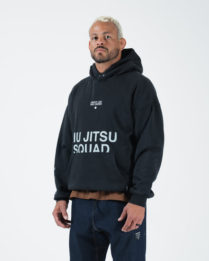 Black BJJ hoodie side angle on adult male model highlighting Jiu Jitsu Squad print and relaxed fit [color:Black]