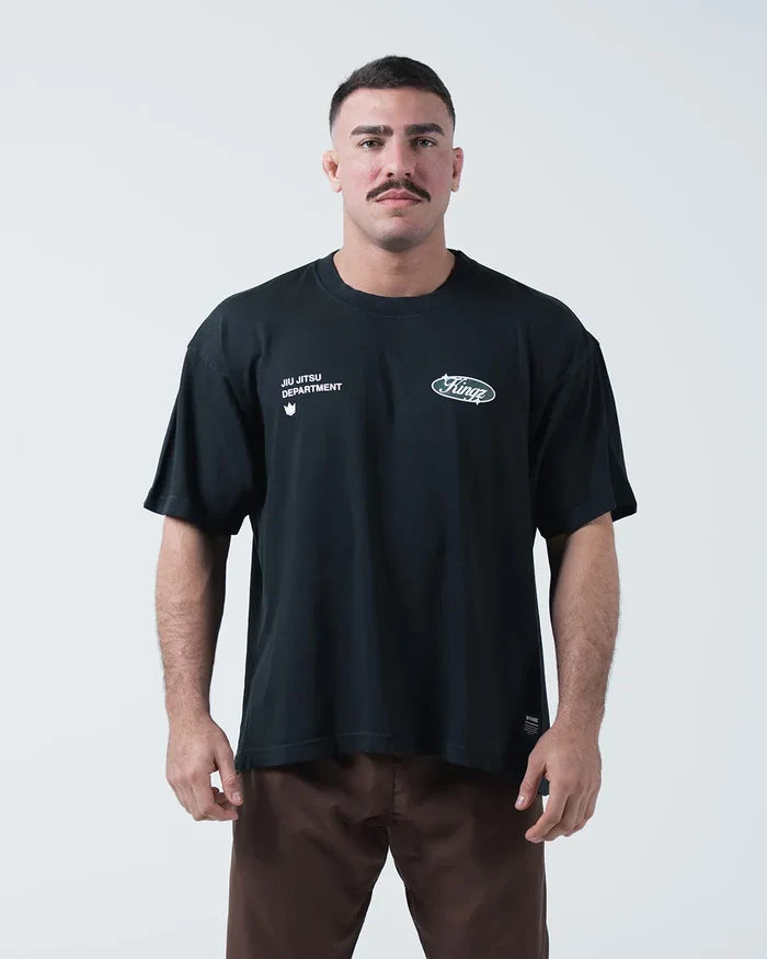 Kingz JJ Dept Tee - Front View - Jiu Jitsu Department Oval Badge Dual Chest Graphics - Black BJJ Tee [color:Black]