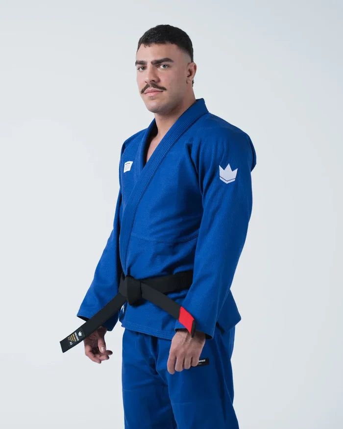 Kingz Kore V2 Jiu Jitsu Gi Blue - Front View Male Athlete Blue Gi White Crown Shoulder Patch Black Belt Red Label Durable Weave BJJ Gi Training [color:Blue]