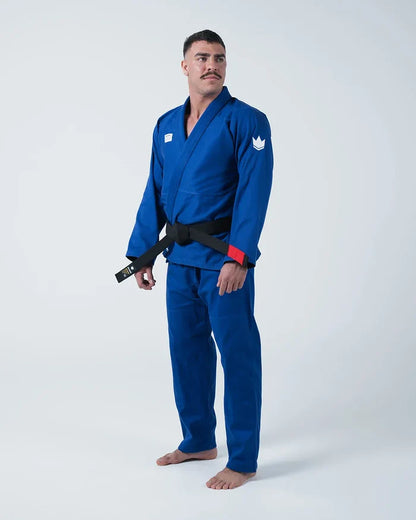 Kingz Kore V2 Jiu Jitsu Gi Blue - Full Body Front View Male Athlete Solid Blue Gi White Crown Badge Left Arm Black Belt Red Sleeve Trim BJJ Training Gi [color:Blue]