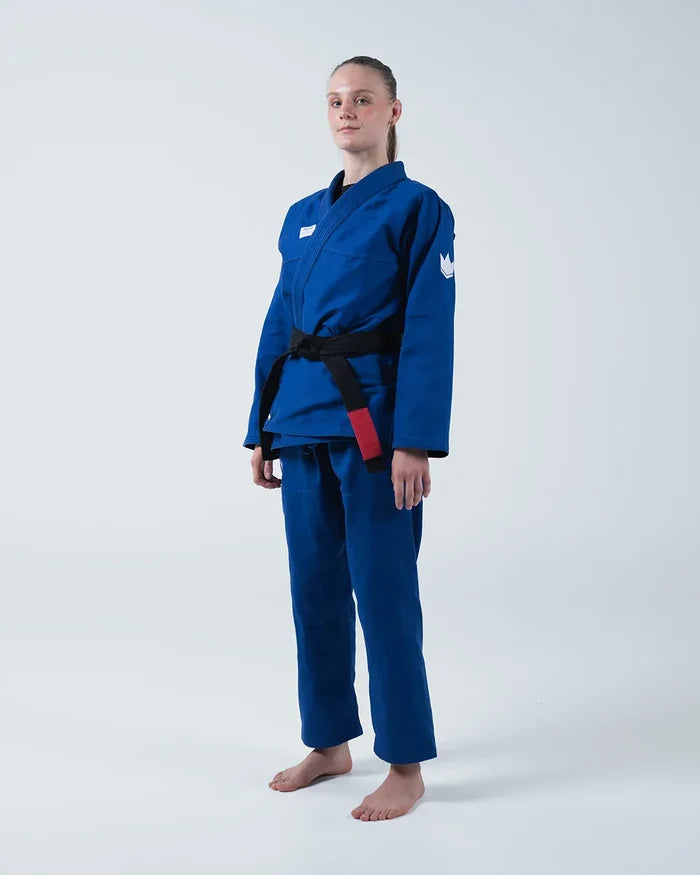 Kingz Kore V2 Women's BJJ Gi Blue - Full Body Angled Front View Female Athlete Black Belt Crown Logo Right Sleeve