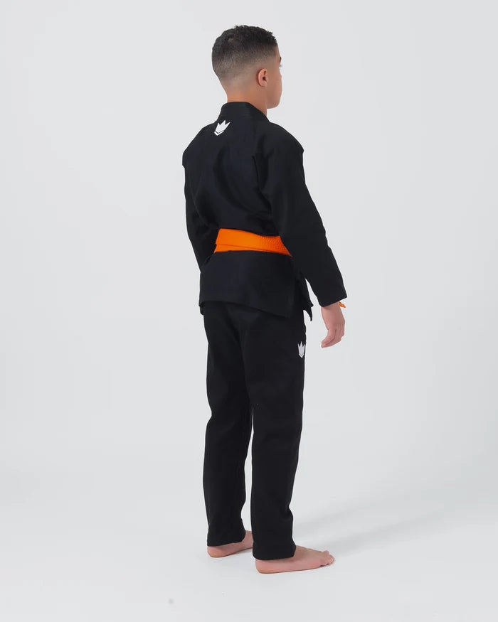 Kingz Kore V2 Youth BJJ Gi Black - Full Body Side Back View Youth Athlete Orange Belt Crown Logo Youth Kids Gi