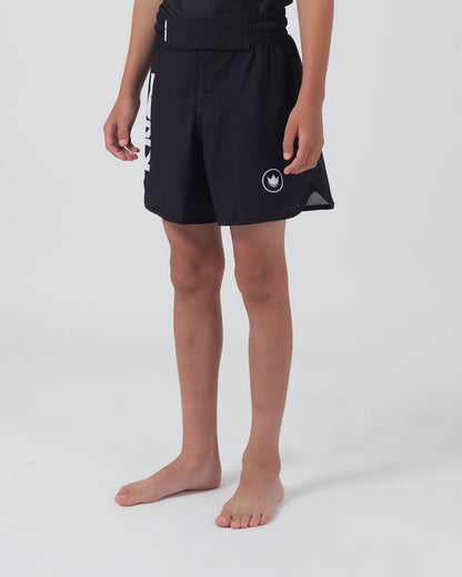 Kingz Kore V2 Youth Shorts Black - Full Body Right Side Profile Teen Boy Athlete Solid Black Crown Badge Right Thigh KINGZ Bold Text Left Leg Visible Kids Grappling Shorts No-Gi BJJ Kore Collection [color:Black]