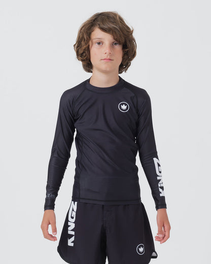 Kingz Kore V2 Youth L/S Rashguard Navy Black - Full Body Front View Teen Boy Athlete Long Sleeve Navy Blue Minimal Design White Crown Logo Circle Chest KINGZ White Sleeve Text Matching Navy Shorts Kids BJJ Training [color:Black]