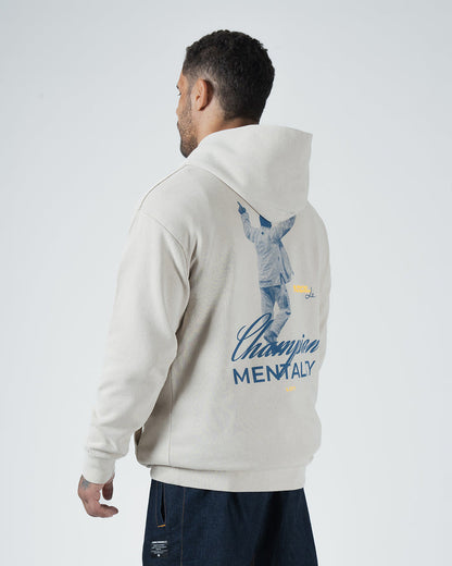 Tan BJJ Champion hoodie back three-quarter view on adult male model showing Champion Mentality back art [color:French Oak]