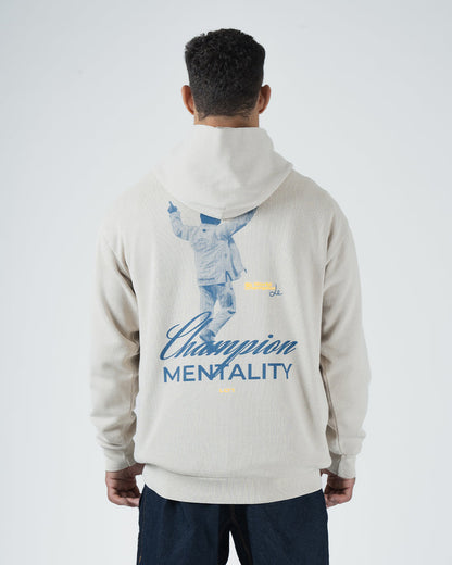 Tan BJJ Champion hoodie back view on adult male model displaying full Champion Mentality athlete print [color:French Oak]