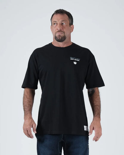 Kingz Leandro Lo Respect Tee - Model Wearing - Upward Angle Shot - Black BJJ Champion Tribute T-Shirt [color:Black]