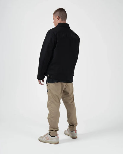 Kingz Mechanic Jacket Black - Back View Male Athlete Black Embroidered Text Upper Back Buttoned Cuffs Relaxed Fit Outerwear BJJ Training Apparel [color:Black]