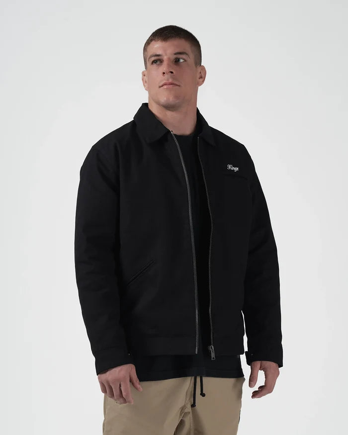 Kingz Mechanic Jacket Black - Front View Male Athlete Black Zip-Up Jacket Embroidered Kingz Logo Left Chest Classic Collar Full-Length Sleeves Casual Fit Outerwear BJJ Training [color:Black]