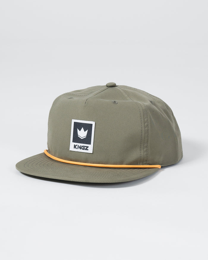 Kingz Original V2 Snapback - Green - Angled View Olive Green Hat Black White Crown Badge Front Panel Yellow Piping Detail KINGZ Text Casual Fit BJJ Training Apparel [color:Green]