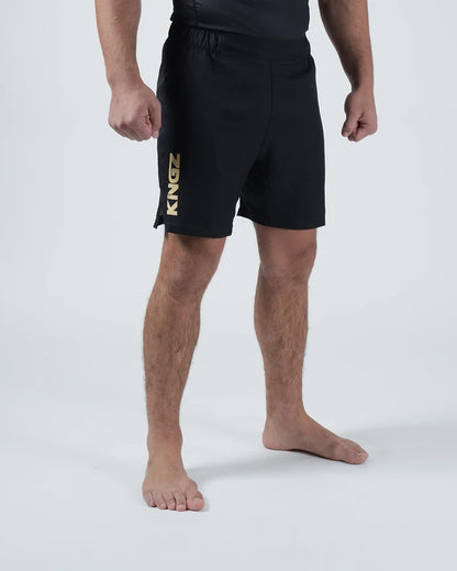 Kingz Player Special Limited Edition Shorts Black Gold - Full Body 3/4 Angled Front View Male Athlete All-Black KINGZ Gold Metallic Vertical Text Left Leg Competition Cut Men's Grappling Shorts No-Gi BJJ Limited Edition [color:Black]