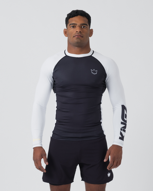 Kingz Ranked Performance V2 L/S Rashguard Navy White - Full Body Front View Male Athlete Long Sleeve Navy Blue Body White Raglan Sleeves White Crown Logo Chest KINGZ White Sleeve Text White Collar Matching Navy Shorts BJJ IBJJF [color:White]