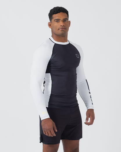 Kingz Ranked Performance V2 L/S Rashguard Navy White - Full Body Front Angled View Male Athlete Long Sleeve Navy Body White Sleeves Yellow Gold IBJJF Rank Cuff Crown Logo Chest Navy Shorts Compression Fit BJJ Ranked Guard [color:White]