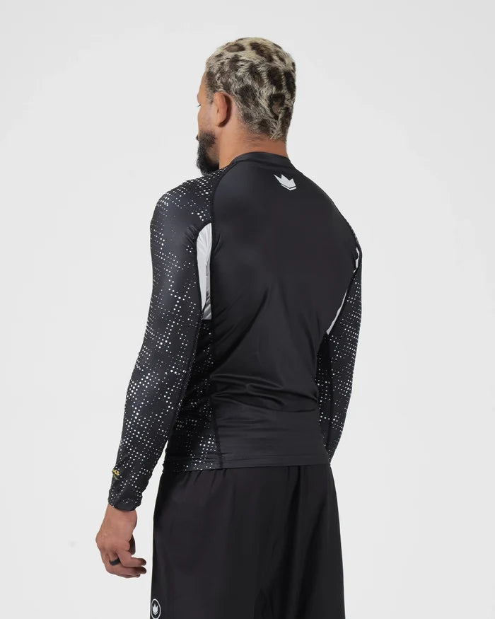 Kingz Ranked Performance V3 L/S Rashguard Black - Full Body 3/4 Back View Right Side Male Athlete Long Sleeve Crown Logo Patterned Dot Sleeves White Arm Panels [color:Black]