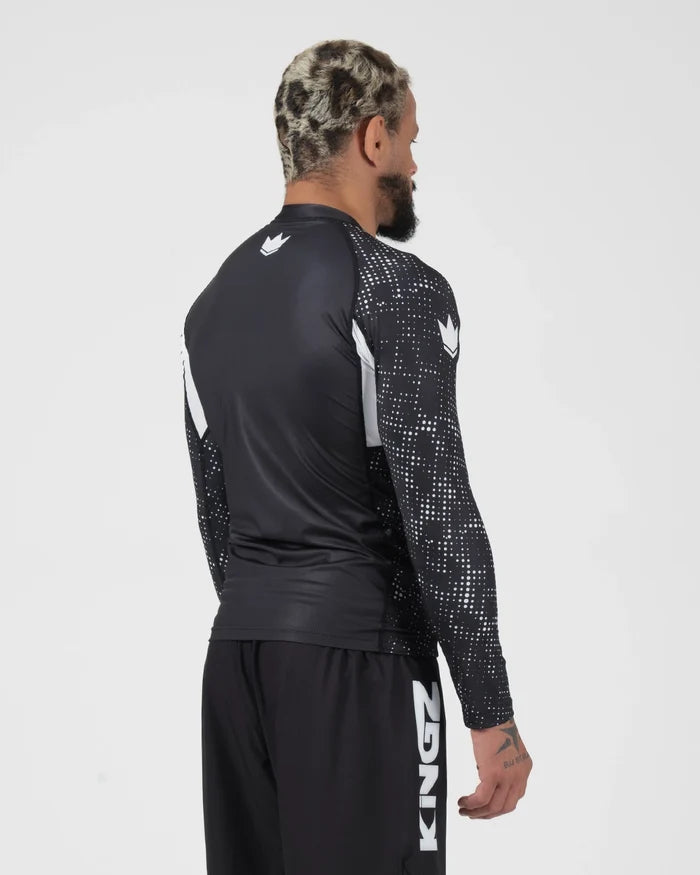 Kingz Ranked Performance V3 L/S Rashguard Black - Full Body 3/4 Back View Left Side Male Athlete Long Sleeve Crown Logo Patterned Dot Sleeves White Arm Panels KINGZ Shorts [color:Black]