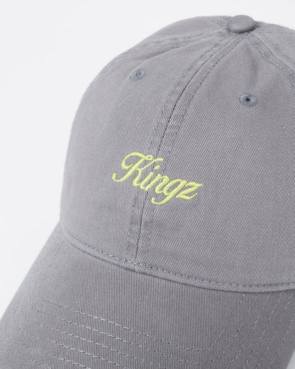 Kingz Script Dad Hat Grey - Close-Up Detail View Embroidered Yellow Kingz Script Logo Centered Grey Cotton Fabric Curved Brim Ventilation Eyelets Casual Fit BJJ Training Hat [color:Grey]