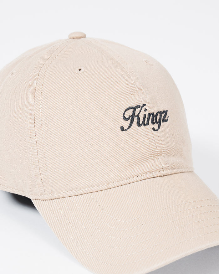 Kingz Script Dad Hat - Khaki - Close-Up Front View Embroidered Black Kingz Script Text Curved Brim Ventilation Eyelets Beige Cotton Casual Fit BJJ Training Apparel [color:Beige]