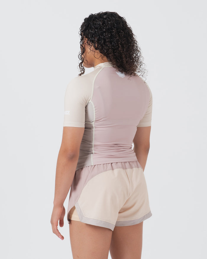Kingz Terra Women's Rashguard Soil Edition - Full Body Back View Female Athlete Short Sleeve Dusty Rose Mauve Body Cream Beige Raglan Sleeves White Crown Logo Upper Back Matching Hybrid Shorts Cream Beige Body Mauve Trim Women's BJJ [color:Baby Pink]