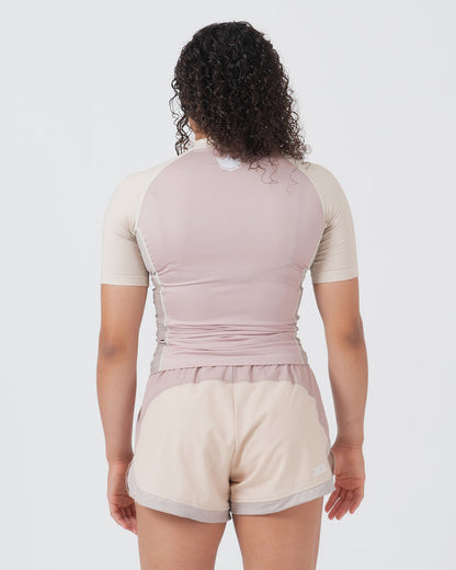 Kingz Terra Women's Rashguard Soil Edition - Full Body Straight Back View Female Athlete Short Sleeve Dusty Rose Mauve Body Cream Beige Raglan Sleeves White Crown Logo Center Back Matching Cream Beige Hybrid Shorts Mauve Waistband Women's BJJ No-Gi [color:Baby Pink]