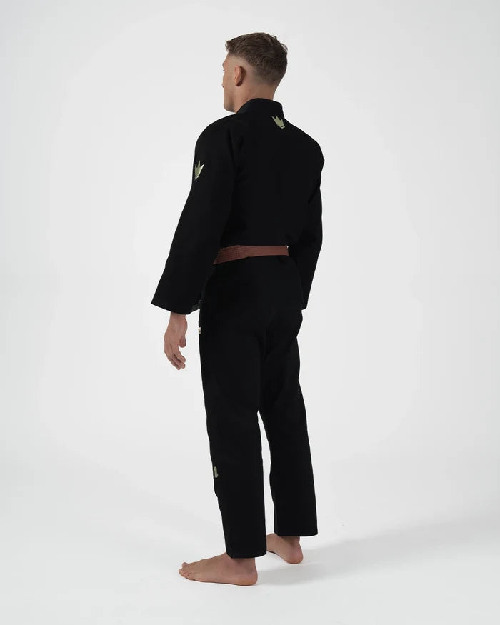 Kingz The ONE V2 LE BJJ Gi Black Green standing front view showing green pant logo and accent trim