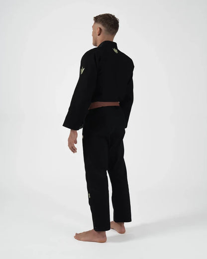 Kingz The ONE V2 LE BJJ Gi Black Green standing front view showing green pant logo and accent trim