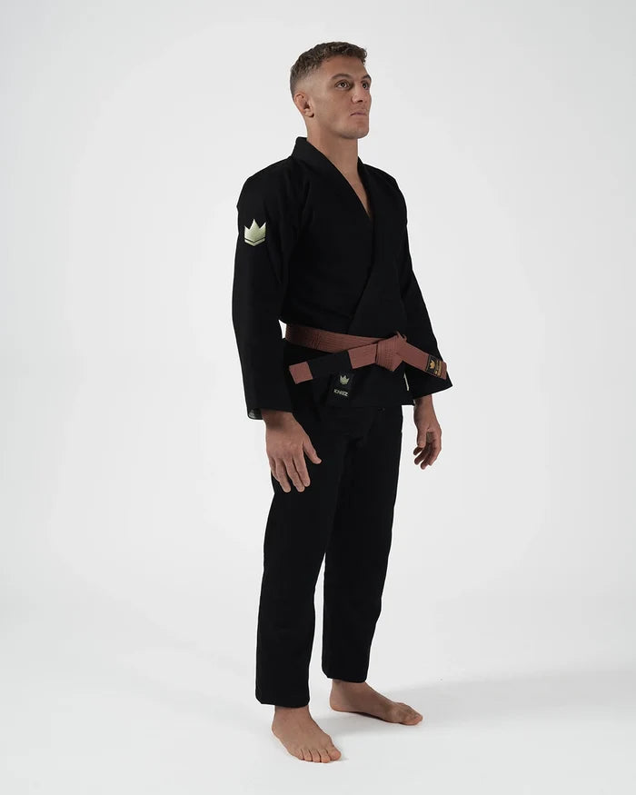Kingz The ONE V2 LE BJJ Gi Black Green angled full body stance showing brown belt and green crown patch