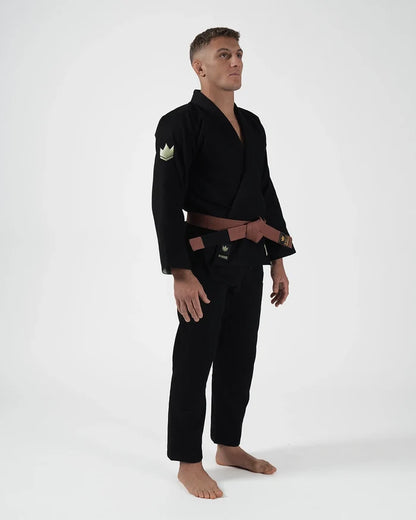 Kingz The ONE V2 LE BJJ Gi Black Green angled full body stance showing brown belt and green crown patch