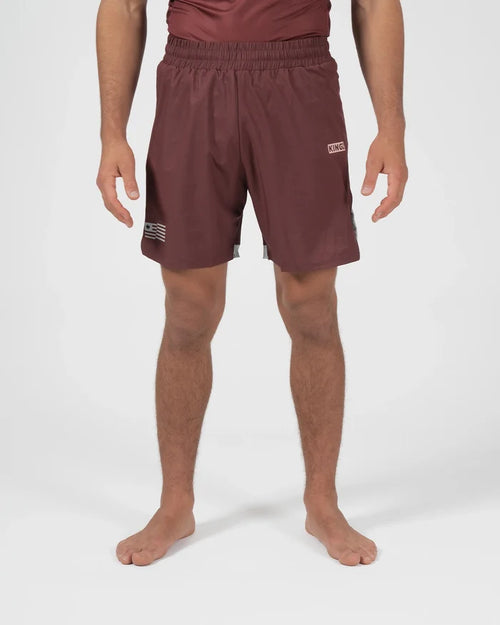 Kingz Trooper Shorts Maroon - Full Body Front View Male Athlete Maroon Burgundy Color KINGZ Badge Right Thigh Flag Badge Left Leg Inner Compression Shorts Gray Trim Competition Cut Men's Grappling Shorts No-Gi BJJ [color:Maroon]