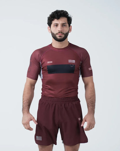 Kingz Trooper Rashguard Maroon - Full Body Front View Male Athlete Short Sleeve KINGZ Logo Black Chest Band Flag Patch Sublimated Graphics [color:Maroon]