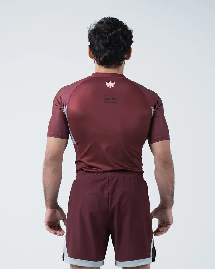 Kingz Trooper Rashguard Maroon - Full Body Straight Back View Male Athlete Short Sleeve Crown Logo Centered Upper Back Dot Pattern Gray Side Panels [color:Maroon]