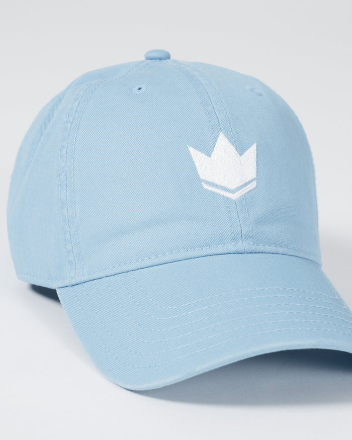 Kingz Kore Dad Hat Baby Blue - Angled View Baby Blue Cotton Cap White Embroidered Crown Logo Front Panel Curved Brim Ventilation Eyelets Casual Fit BJJ Training Apparel [color:Baby Blue]