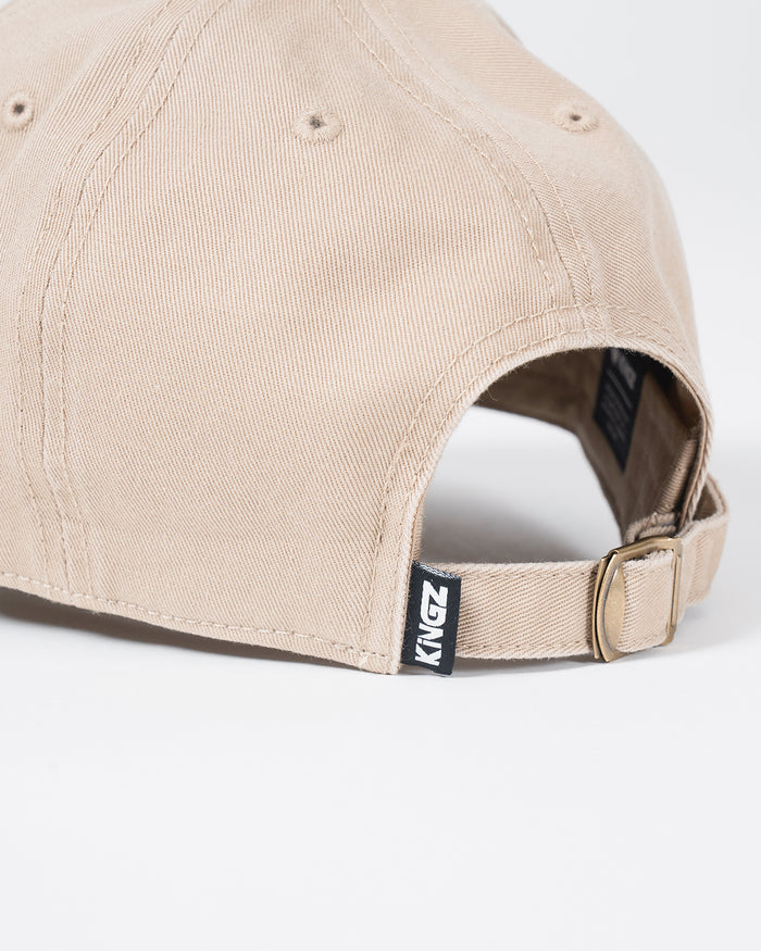 Kingz Kore Dad Hat Khaki - Close-Up Back View Adjustable Strap Beige Fabric KINGZ Tag Brass Buckle Casual Design BJJ Training Apparel [color:Beige]