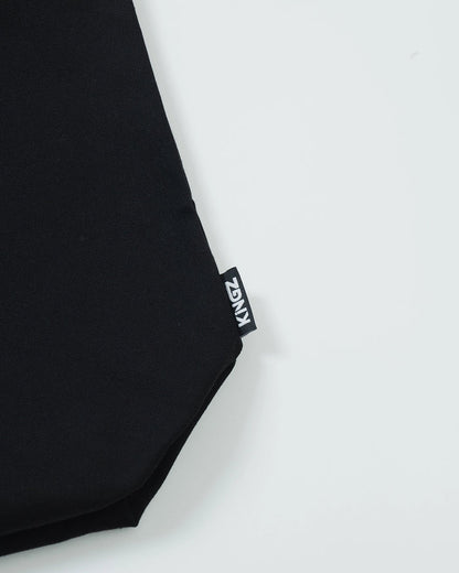 Kingz Kore Eco Bag - Side KINGZ Label Close-Up - Woven Branding on Black Canvas Material BJJ Bag