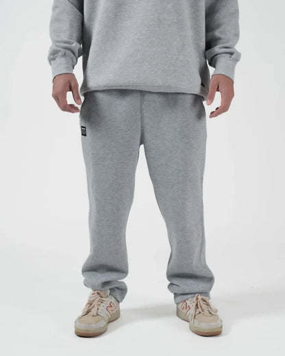 Kingz Loungewear Jogger Grey - Front View Male Athlete Grey Jogger Pants Elastic Waistband Black Kingz Patch Left Thigh Relaxed Fit Casual Wear BJJ Training [color:Black]