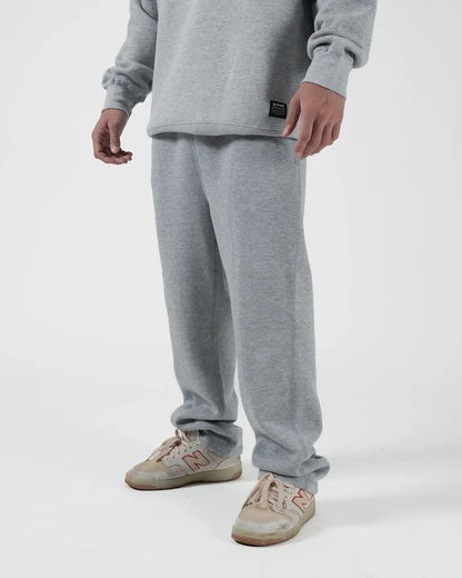 Kingz Loungewear Jogger Grey - Full Body Front View Male Athlete Grey Soft Fabric Elastic Waistband Relaxed Fit Black Kingz Logo Patch Casual Wear BJJ Training [color:Black]