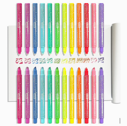 Set of colorful markers with a clear holder on a white background