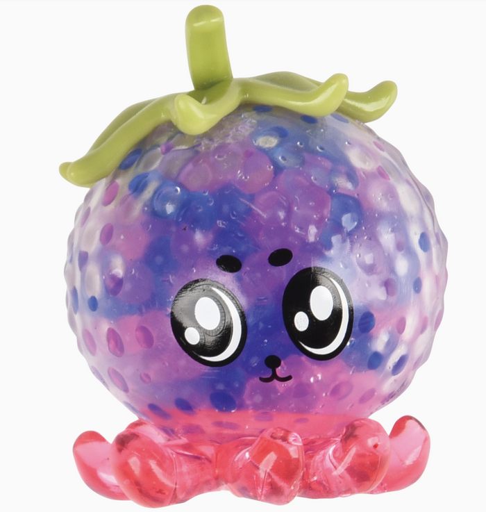 Colorful toy resembling a grape with a face on a white background