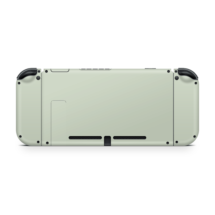 Nintendo Switch with sage green skin applied showing full coverage