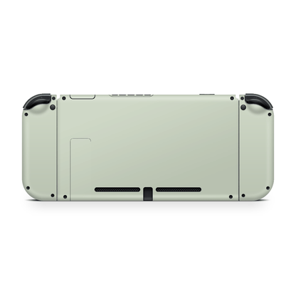 Nintendo Switch with sage green skin applied showing full coverage