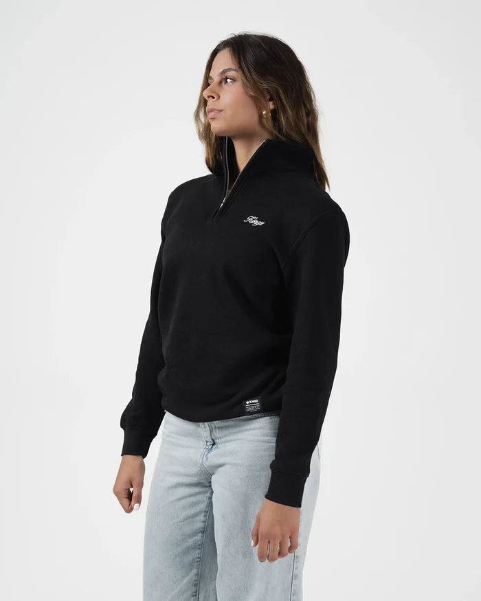 Kingz Script Quarter Zip Sweater Black - Front View Female Model Black Sweater White Script Logo Chest Quarter Zip High Collar Ribbed Cuffs Casual Fit BJJ Training Apparel [color:Black]