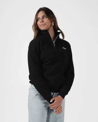 Kingz Script Quarter Zip Sweater Black - Front View Female Model Black Sweater White Script Logo Left Chest Quarter Zip Collar Casual Fit Light Gray Jeans BJJ Training Apparel [color:Black]