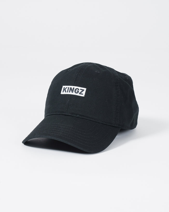 Kingz Slant Dad Hat - Black - Angled Front View Embroidered KINGZ Text Center Panel Curved Brim Classic Fit Black Cotton Casual Headwear BJJ Lifestyle [color:Black]