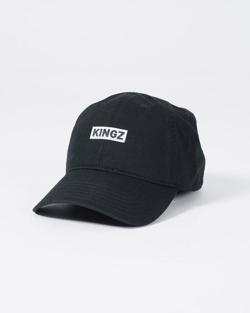Kingz Slant Dad Hat - Black - Angled Front View Embroidered KINGZ Text Center Panel Curved Brim Classic Fit Black Cotton Casual Headwear BJJ Lifestyle [color:Black]