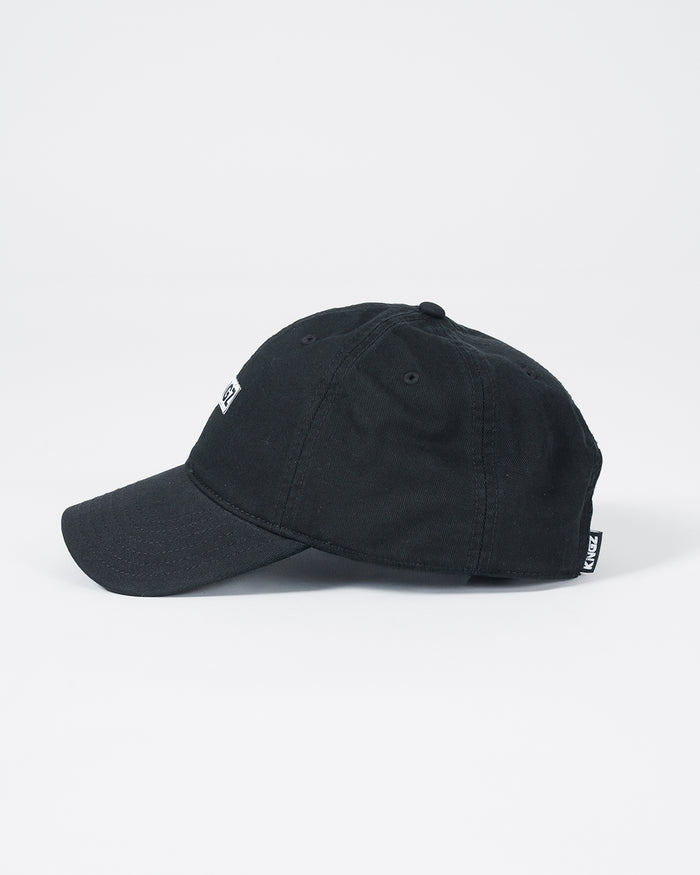 Kingz Slant Dad Hat - Black - Side View Black Cotton Curved Brim White KINGZ Logo Tag Back Adjustable Strap Casual Fit BJJ Training Hat [color:Black]