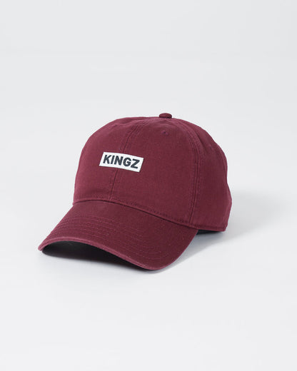 Kingz Slant Dad Hat - Maroon - Angled Front View KINGZ Text Patch Centered Maroon Cotton Curved Brim Casual Fit BJJ Training Apparel [color:Maroon]